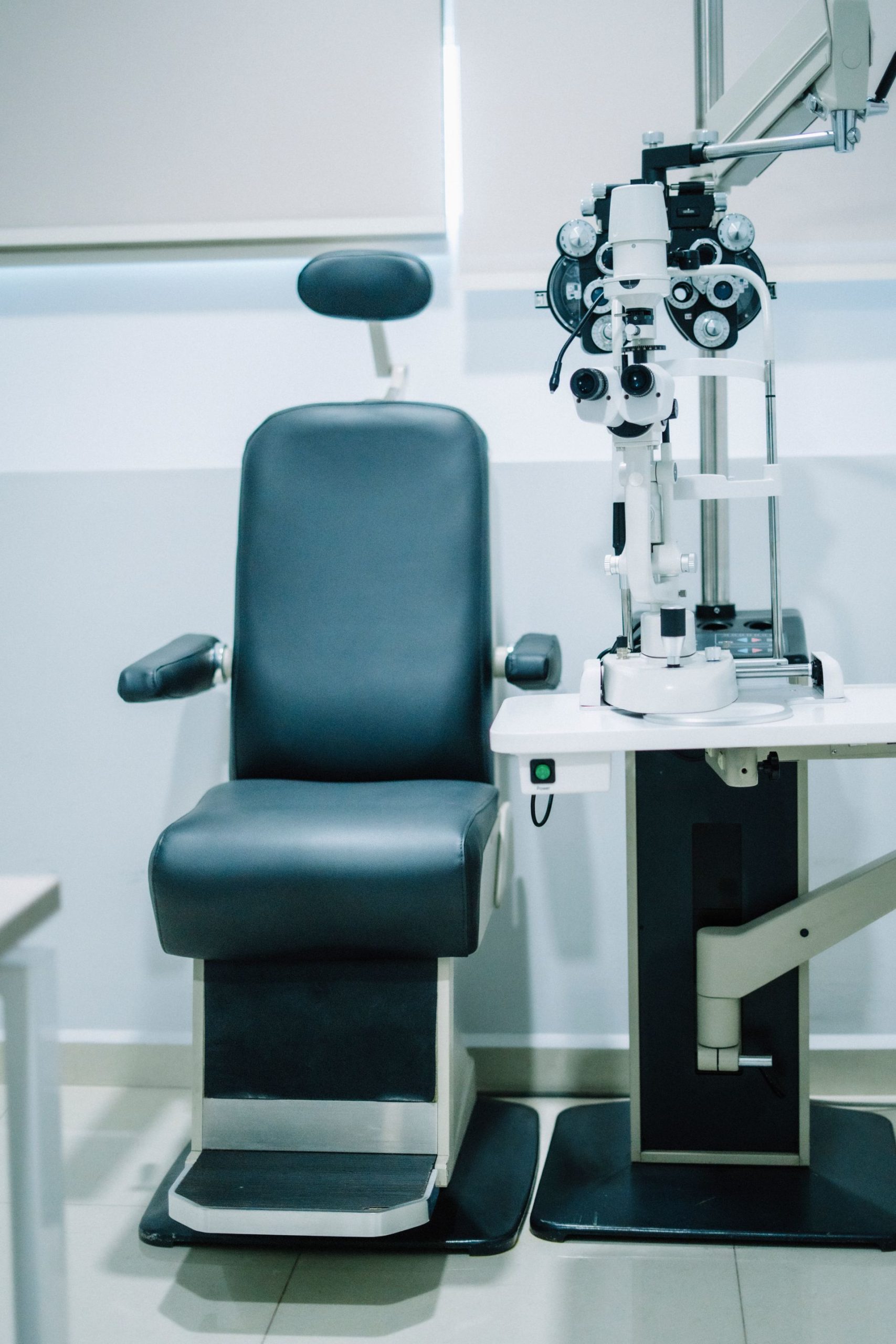 Clean, well-organized clinical exam room with medical equipment