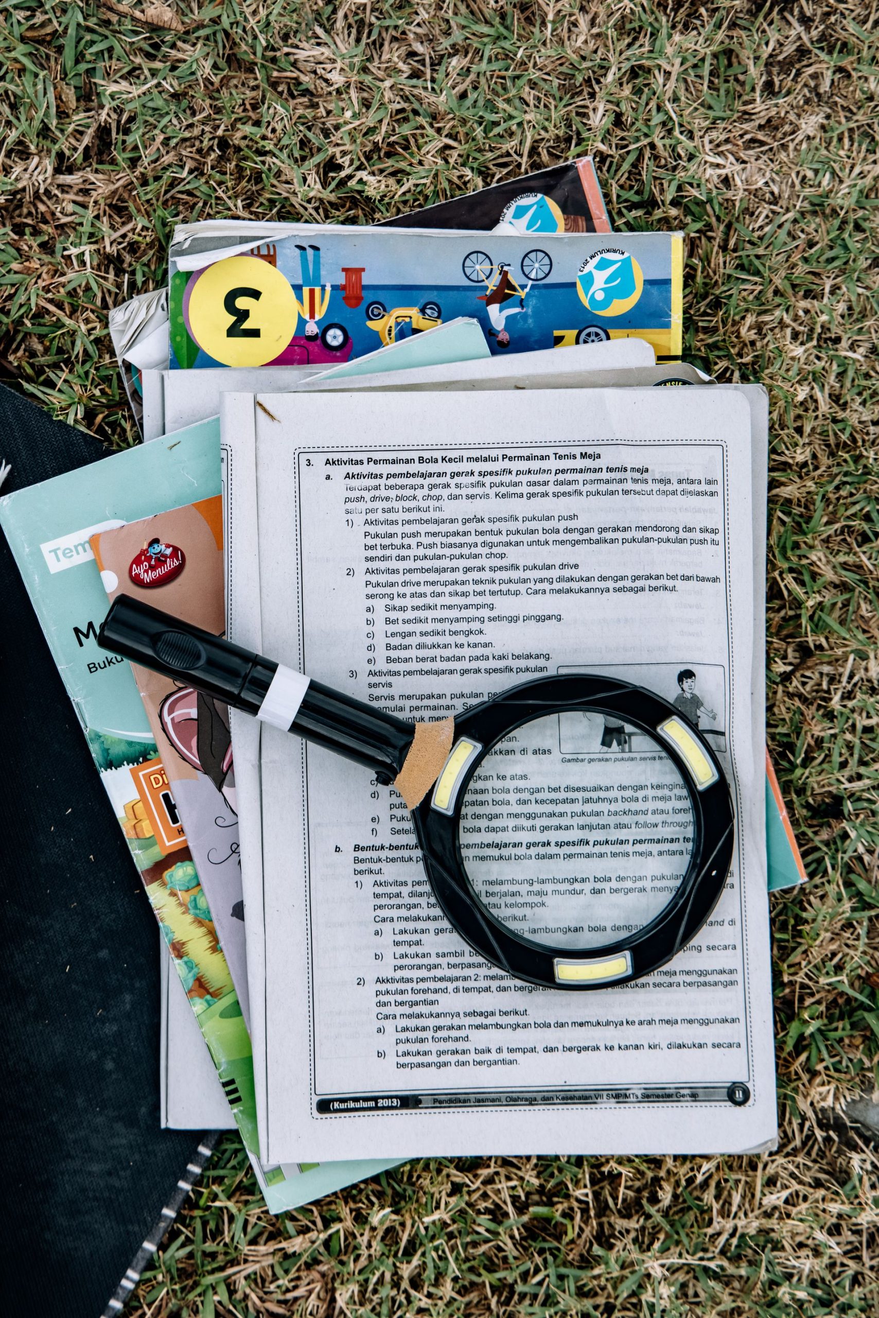 Magnifying glass over documents symbolizing a security risk assessment